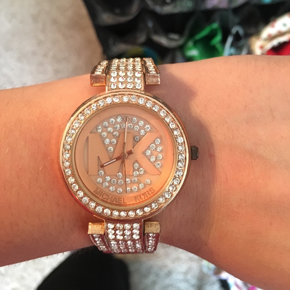 MK rose gold watch.